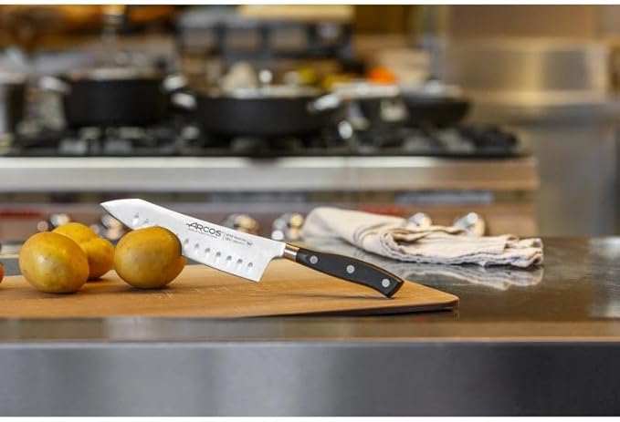 ARCOS Rocking Santoku Knife 7 Inch Stainless Steel. Japanese Professional Kitchen Knife for Cutting Fruits and Vegetables. Ergonomic Black Handle. Series Riviera Blanc