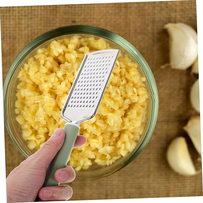 PRETYZOOM Stainless Steel Garlic Mincer Zester Efficient Grating Tool for Garlic Ginger Cheese and Vegetables Versatile Kitchen Utensil Easy to Clean Design