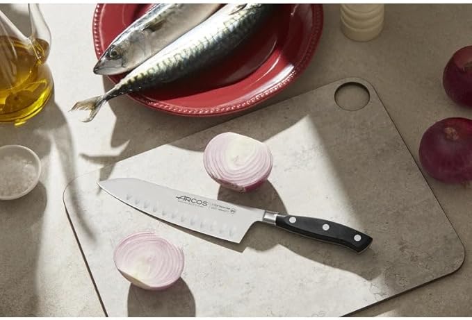 ARCOS Rocking Santoku Knife 7 Inch Stainless Steel. Japanese Professional Kitchen Knife for Cutting Fruits and Vegetables. Ergonomic Black Handle. Series Riviera Blanc
