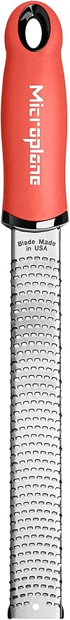 Microplane Zester Grater in Coral for Citrus Fruits, Hard Cheese, Ginger, Chocolate and Nutmeg with Fine Stainless Steel Blade - Made in USA