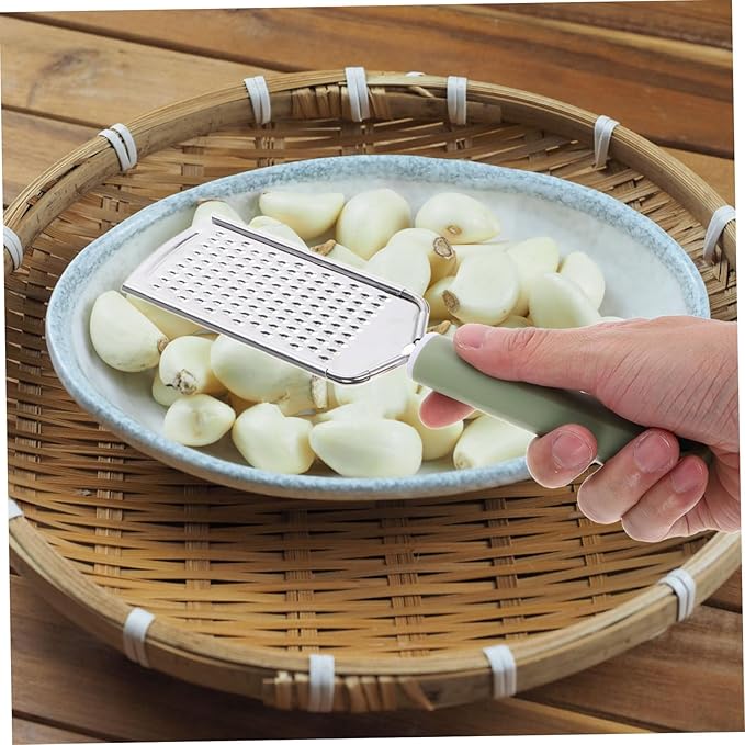 Stainless Steel Cheese Grater Garlic Zester Ergonomic Handheld Kitchen Tool for Efficient Grating of Garlic Ginger and Cheese Easy to Clean Comfortable Grip