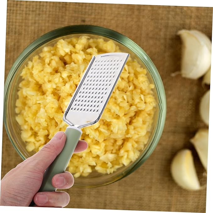 Stainless Steel Cheese Grater Garlic Zester Ergonomic Handheld Kitchen Tool for Efficient Grating of Garlic Ginger and Cheese Easy to Clean Comfortable Grip