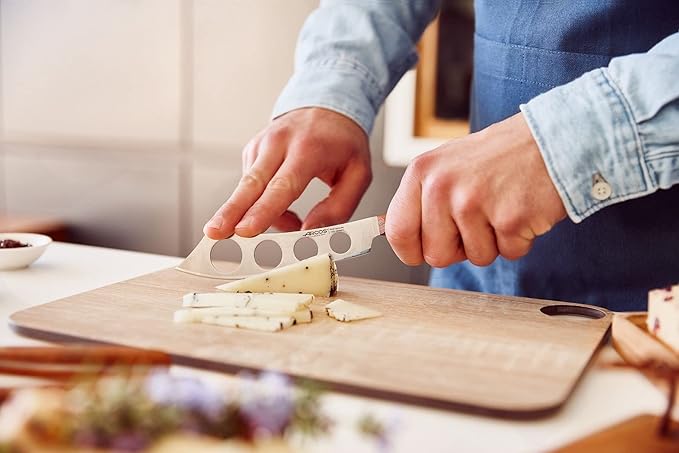 Arcos Cheese Knife set 3 pieces. Nitrum Stainless Steel. Very useful set for irregular pieces of hard cheeses, soft cheeses and creamy cheeses. Handle 100% Ovengkol wood Series Nordika. Color Brown.