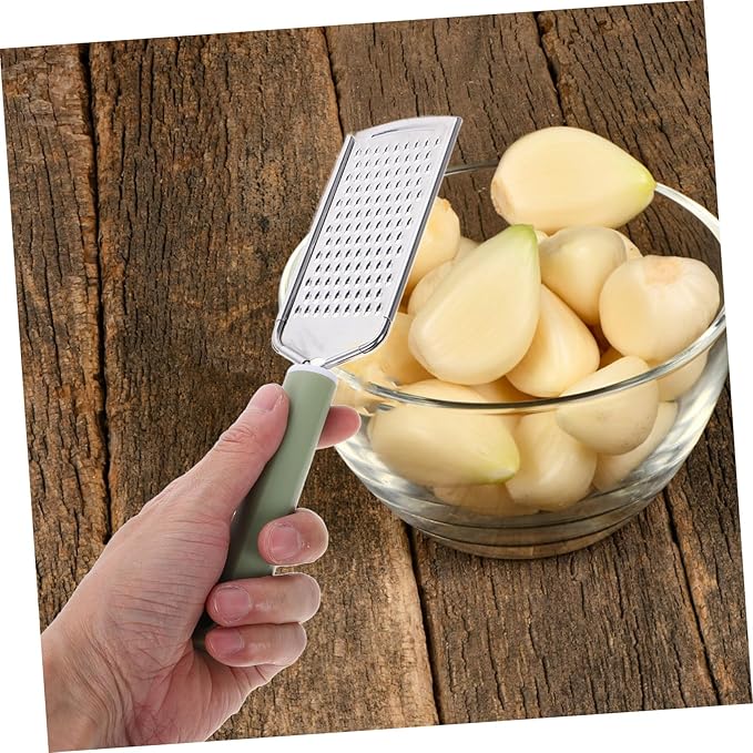 PRETYZOOM Stainless Steel Garlic Mincer Zester Efficient Grating Tool for Garlic Ginger Cheese and Vegetables Versatile Kitchen Utensil Easy to Clean Design