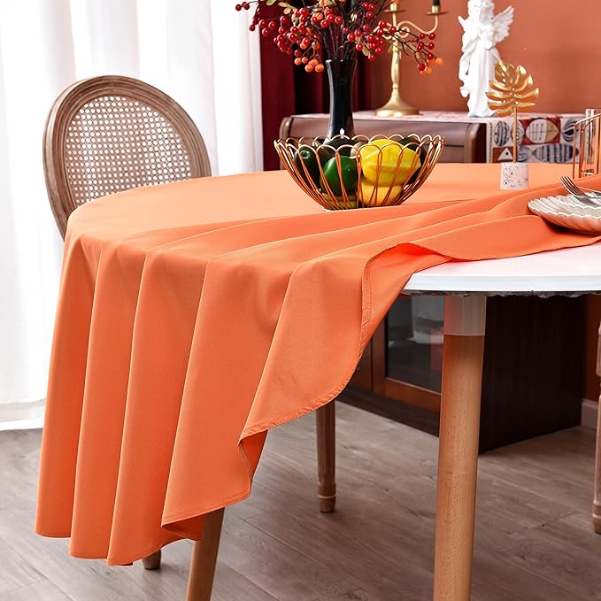 MEANMOY 2 Pack Orange 210 GSM Water & Stain Resistant Round Tablecloth - Solid 70 Inch Circle Table Cloth Cover in Wrinkle Free Washable Wipe Clean Polyester for Wedding, Party, Banquet (2 Pcs)
